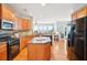Well-appointed kitchen with granite countertops, stainless steel appliances, wood cabinets, and an island workstation at 233 Hampton Station Blvd, Canton, GA 30115