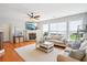 Spacious living room with hardwood floors, fireplace, and plenty of natural light at 233 Hampton Station Blvd, Canton, GA 30115