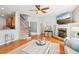 Inviting living room with hardwood floors, a fireplace, and neutral paint at 233 Hampton Station Blvd, Canton, GA 30115