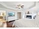 Spacious main bedroom features hardwood floors, fireplace, tray ceiling, large windows, and ensuite bathroom at 233 Hampton Station Blvd, Canton, GA 30115