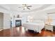 Spacious main bedroom with hardwood floors, fireplace, tray ceiling, and large windows at 233 Hampton Station Blvd, Canton, GA 30115