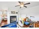 Stylish office showcasing a fireplace, ceiling fan, and a view of an adjacent bedroom at 233 Hampton Station Blvd, Canton, GA 30115