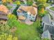 Aerial shot displays the home's backyard, complete with a lawn, patio, deck and mature landscaping at 358 Woodbrook Crst, Canton, GA 30114