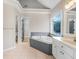 Bathroom with a large soaking tub, double vanity, and separate toilet room at 358 Woodbrook Crst, Canton, GA 30114