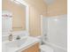 Bright bathroom features a white vanity with a large mirror, alongside a convenient shower-tub combination at 358 Woodbrook Crst, Canton, GA 30114