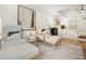Elegant bedroom with neutral colors, seating, and plenty of natural light at 358 Woodbrook Crst, Canton, GA 30114