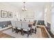 Formal dining room featuring neutral decor, hardwood floors, and elegant lighting at 358 Woodbrook Crst, Canton, GA 30114