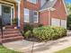 Welcoming front entrance with brick steps and manicured landscaping at 358 Woodbrook Crst, Canton, GA 30114