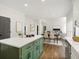 Open-concept kitchen with island opens to dining and living spaces at 358 Woodbrook Crst, Canton, GA 30114