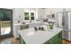 Modern kitchen with a large center island, stainless steel appliances, and white cabinets at 358 Woodbrook Crst, Canton, GA 30114