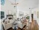 Open concept living room featuring a fireplace and a view into the modern kitchen at 358 Woodbrook Crst, Canton, GA 30114