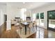 Open concept living and dining area with fireplace and access to outdoor deck at 358 Woodbrook Crst, Canton, GA 30114
