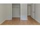 Bedroom closet showcasing ample storage space with white shelving and wood-look floors, maximizing organization at 3614 Spring Leaf Ln, Acworth, GA 30101