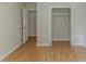 Bedroom closet showcasing ample storage space with white shelving and wood-look floors, maximizing organization at 3614 Spring Leaf Ln, Acworth, GA 30101