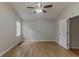Main bedroom featuring a ceiling fan, window, and wood-look flooring, providing a comfortable and relaxing atmosphere at 3614 Spring Leaf Ln, Acworth, GA 30101