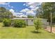 Backyard view of well-maintained, single-story brick home with nice yard at 1035 Cornish Mountain Church Rd, Oxford, GA 30054