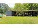 Large backyard featuring a storage structure and green space at 1035 Cornish Mountain Church Rd, Oxford, GA 30054