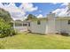 Backyard view of well-maintained, single-story brick home with nice yard at 1035 Cornish Mountain Church Rd, Oxford, GA 30054