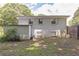 Backyard view of well-maintained, single-story brick home with nice yard at 1035 Cornish Mountain Church Rd, Oxford, GA 30054