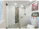 Elegant bathroom with a glass-enclosed shower, modern fixtures and tile, and a toilet at 1035 Cornish Mountain Church Rd, Oxford, GA 30054