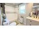 Bathroom with updated tile, granite vanity, a toilet and a shower with a white shower curtain at 1035 Cornish Mountain Church Rd, Oxford, GA 30054