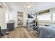 The bedroom has hardwood floors, a television, a desk, and a comfortable bed at 1035 Cornish Mountain Church Rd, Oxford, GA 30054