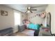 Charming bedroom features natural light, neutral tones, and a ceiling fan, perfect for relaxation at 1035 Cornish Mountain Church Rd, Oxford, GA 30054