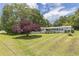 Charming one-story brick home with a spacious front yard and inviting covered porch at 1035 Cornish Mountain Church Rd, Oxford, GA 30054