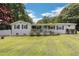 Inviting single-story brick home with a covered porch, perfect for relaxing outdoors at 1035 Cornish Mountain Church Rd, Oxford, GA 30054