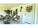 Cozy front porch with charming welcome decor and ample seating to relax at 1035 Cornish Mountain Church Rd, Oxford, GA 30054