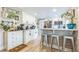 Modern kitchen with white cabinets, stainless steel appliances, and a breakfast bar at 1035 Cornish Mountain Church Rd, Oxford, GA 30054