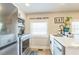 Bright kitchen featuring stainless steel appliances, light countertops and an 