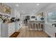 Bright and airy kitchen featuring white cabinets, stainless steel appliances, and an inviting coffee bar area at 1035 Cornish Mountain Church Rd, Oxford, GA 30054