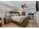 Serene main bedroom with a ceiling fan, a large bed, and ample natural light at 1035 Cornish Mountain Church Rd, Oxford, GA 30054
