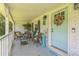 Charming front porch with comfortable seating and stylish decor, welcoming guests at 1035 Cornish Mountain Church Rd, Oxford, GA 30054