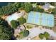 Aerial view of neighborhood amenities featuring a pool, tennis courts, and community clubhouse at 1850 Kirkmont Nw Dr, Marietta, GA 30064