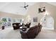 Spacious living room with vaulted ceilings, a fireplace, and access to the outdoors at 1850 Kirkmont Nw Dr, Marietta, GA 30064