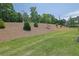 Beautifully landscaped backyard with lush green grass, providing a serene view of the outdoors at 1969 Lanier Harbor Pt, Buford, GA 30518