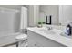 Clean bathroom with a shower-tub combo, white vanity, and modern fixtures at 1969 Lanier Harbor Pt, Buford, GA 30518