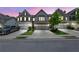 Attractive townhome with a two-car garage, neat landscaping, and an inviting facade at 1969 Lanier Harbor Pt, Buford, GA 30518