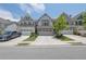 Attractive townhome with a two-car garage, neat landscaping, and an inviting facade at 1969 Lanier Harbor Pt, Buford, GA 30518