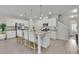 Spacious kitchen with white cabinets, granite countertops, and a large center island with seating at 1969 Lanier Harbor Pt, Buford, GA 30518