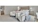 Spacious main bedroom featuring seating area, plush carpeting, and decorative rug at 1969 Lanier Harbor Pt, Buford, GA 30518
