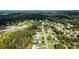 Aerial perspective of the neighborhood, highlighting the lush greenery, community layout, and school nearby at 7090 Valley Landing Ct, Cumming, GA 30041