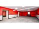 Versatile basement space with carpeted floors, bright lighting, and potential for multiple uses at 7090 Valley Landing Ct, Cumming, GA 30041