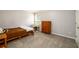 Bedroom with neutral carpeting and a window providing natural light at 7090 Valley Landing Ct, Cumming, GA 30041