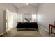 Comfortable bedroom with a vaulted ceiling, neutral walls, and carpeted floors at 7090 Valley Landing Ct, Cumming, GA 30041