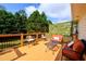 Relaxing deck area with comfortable seating, overlooking lush greenery and providing a serene outdoor retreat at 7090 Valley Landing Ct, Cumming, GA 30041