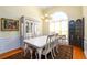 Elegant dining room with hardwood floors, stylish chandelier, and sophisticated decor at 7090 Valley Landing Ct, Cumming, GA 30041