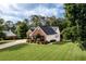 Well-maintained home with brick and siding, complemented by a vibrant green lawn and professional landscaping at 7090 Valley Landing Ct, Cumming, GA 30041